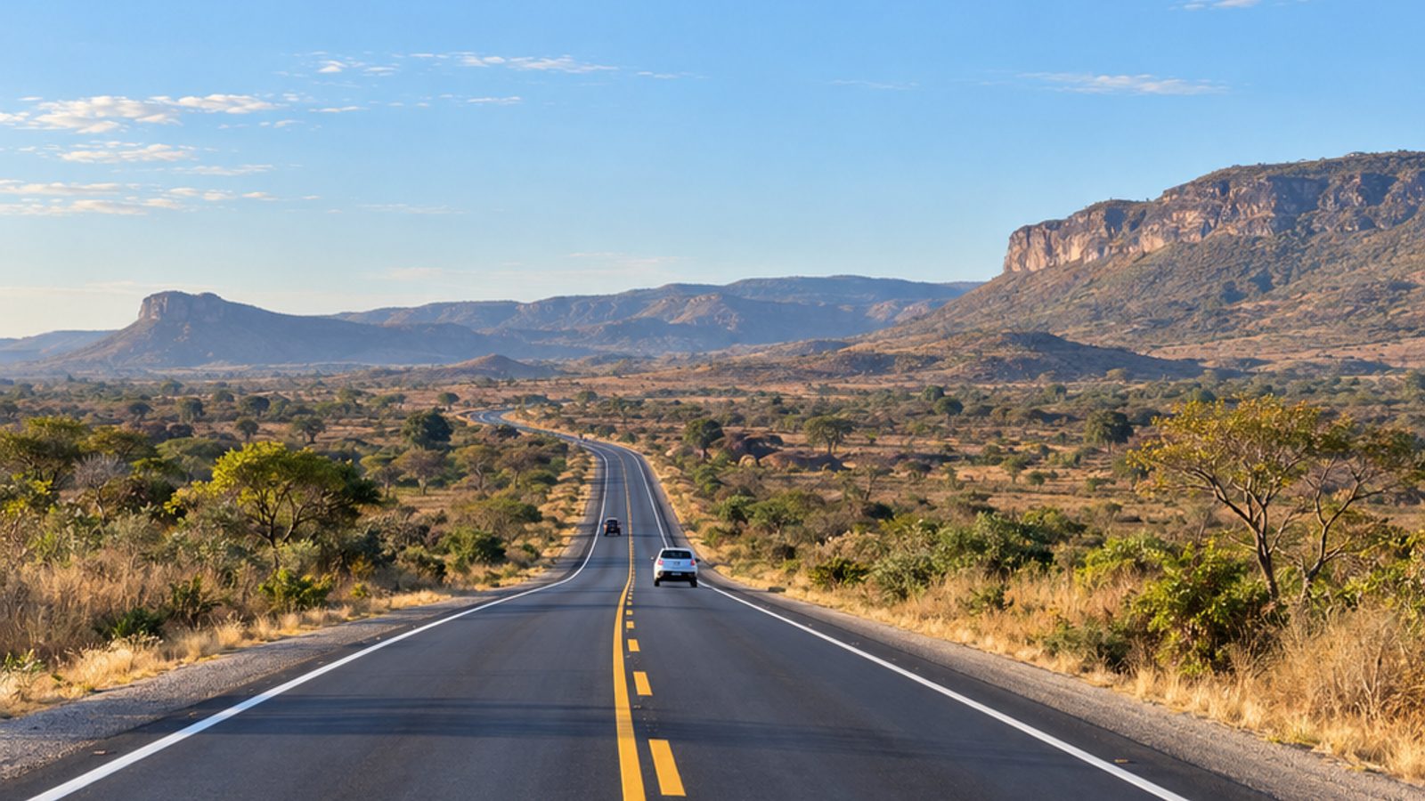 Imagem ilustrativa de rodovia recém-pavimentada no Oeste da Bahia, com veículos e paisagem de cerrado.